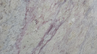 Purple streaks in bianco romano granite is unusual. It is usually pretty white. But this jumped up and said "Look at me!"